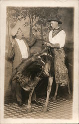 Man dressed as Cowboy riding Burro in "Robbery", Wooly Chaps Studio Photos Postcard Postcard Postcard