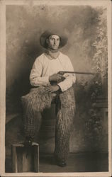 Man Dressed as Cowboy Wearing Wooly Chaps Holding Pistol w/Very Long Barrel Studio Photos Postcard Postcard Postcard