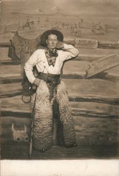 Man Dressed as Cowboy Wearing Wooly Chaps Holding Rifle Postcard