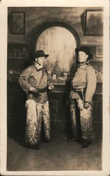 Two Men dressed as cowboys Wooly Chaps, Saloon Studio Photos Postcard Postcard Postcard