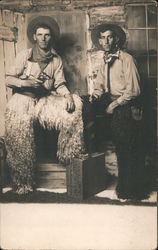 Two Men Dressed as Cowboys Wearing Wooly Chaps Holding Pistols Postcard