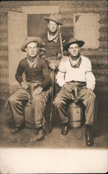 Three Young Men Dressed as Cowboys - Two Sitting on Barrels, One Standing Postcard Postcard Postcard