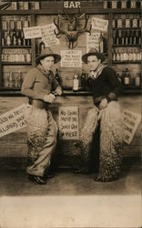 Two Men Dressed as a Cowboys Wearing Wooly Chaps at the Saloon Postcard