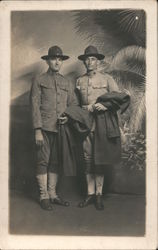 Two WWI military men holding their jackets Postcard