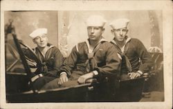 three sailors sitting in a car. Postcard